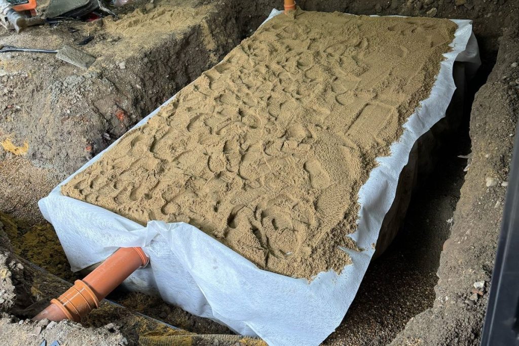Granular backfill over the wrapped attenuation tank, Beckenham