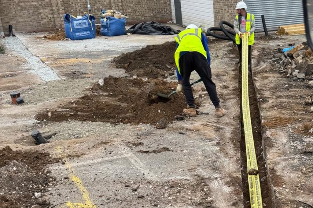 Electrical ducting trench with marker tape, Ipswich car park